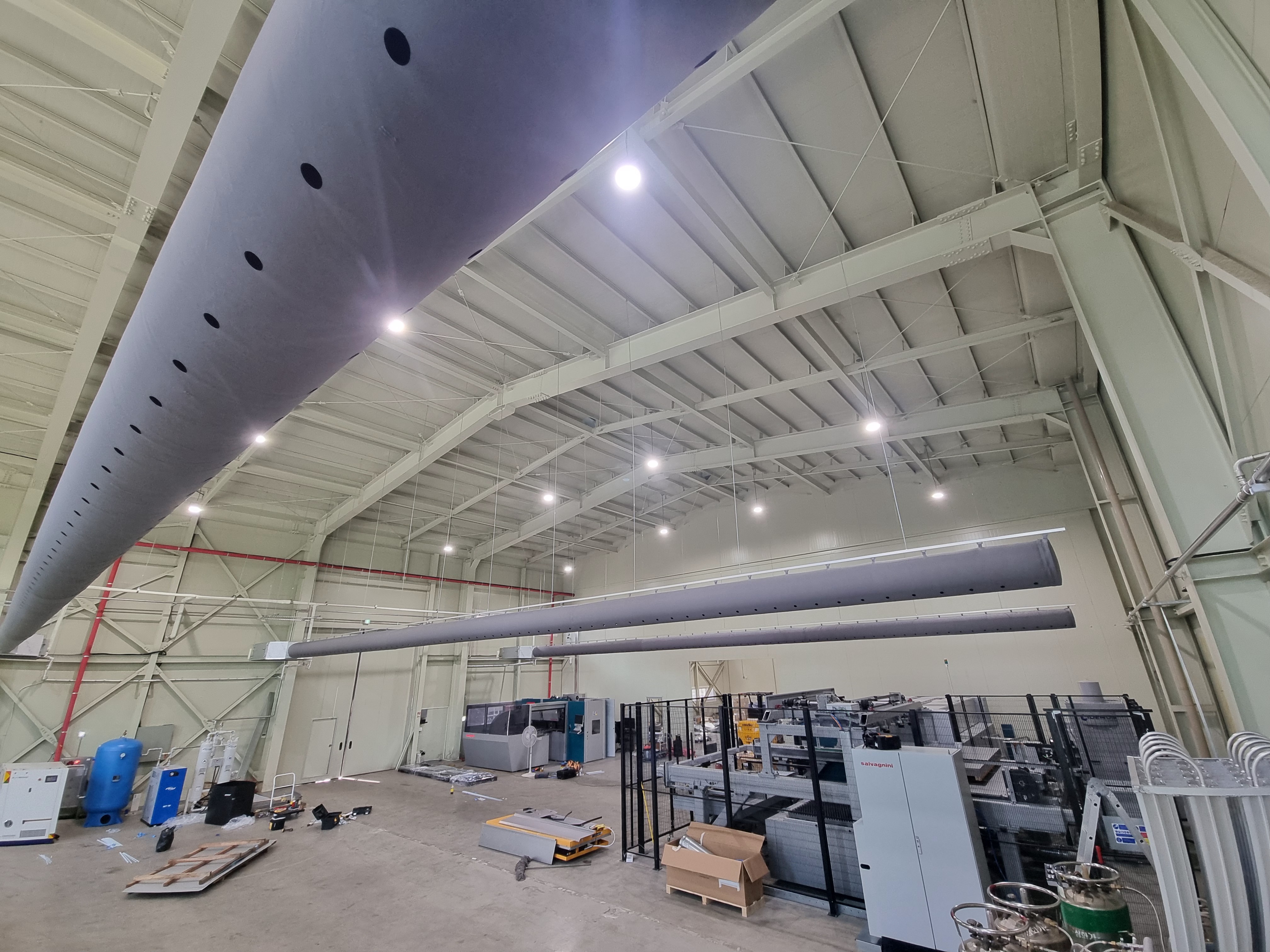 Large fabric duct installed in an industrial facility